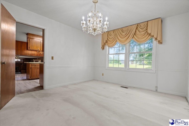 231 Timberlake Dr, Florence, SC 29501 - unfurnished dining area featuring a chandelier and carpet