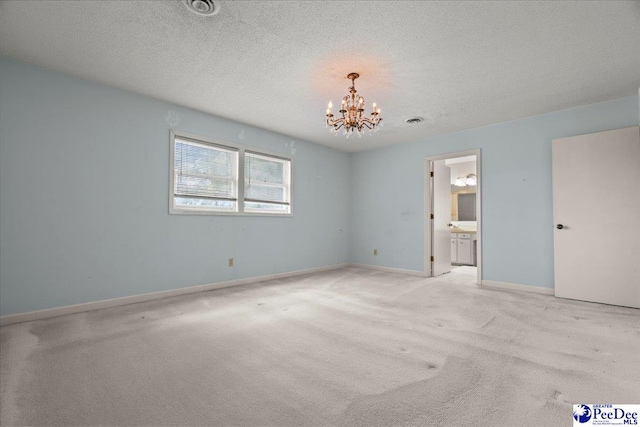 231 Timberlake Dr, Florence, SC 29501 - unfurnished bedroom with a chandelier, light carpet, a textured ceiling, and ensuite bathroom