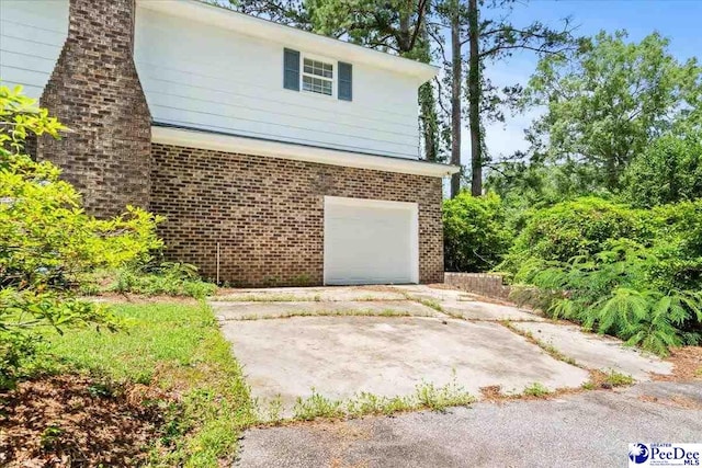 231 Timberlake Dr, Florence, SC 29501 - garage with concrete driveway