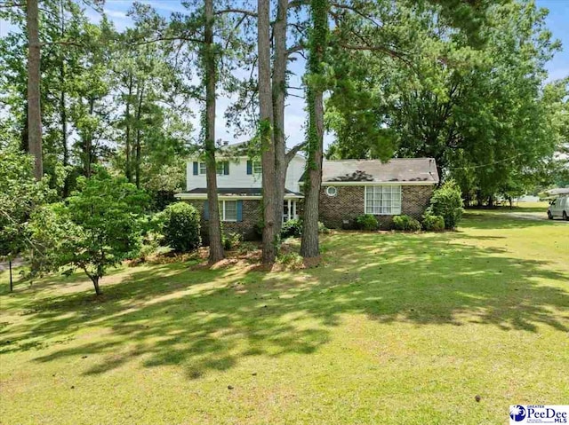 231 Timberlake Dr, Florence, SC 29501 - view of front of property with a front yard and brick siding