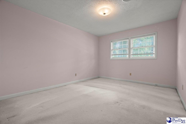 231 Timberlake Dr, Florence, SC 29501 - empty room with carpet floors and a textured ceiling