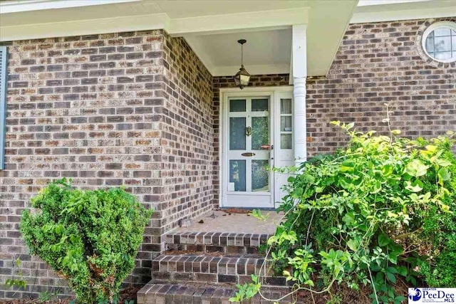 231 Timberlake Dr, Florence, SC 29501 - doorway to property featuring brick siding