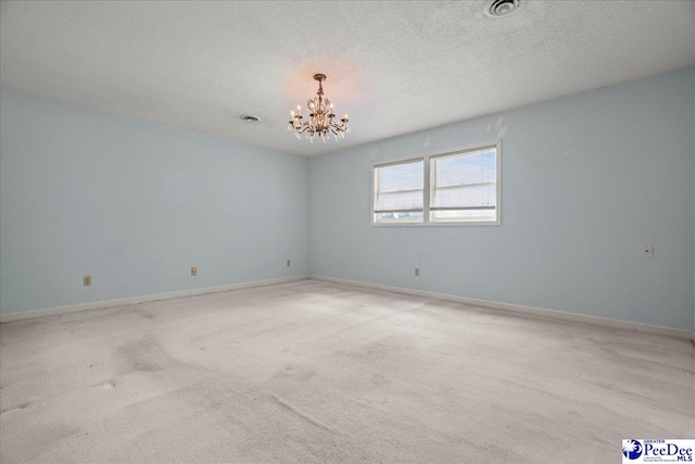 231 Timberlake Dr, Florence, SC 29501 - carpeted spare room featuring a chandelier and a textured ceiling