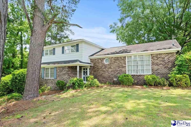 231 Timberlake Dr, Florence, SC 29501 - split level home with brick siding and a front lawn
