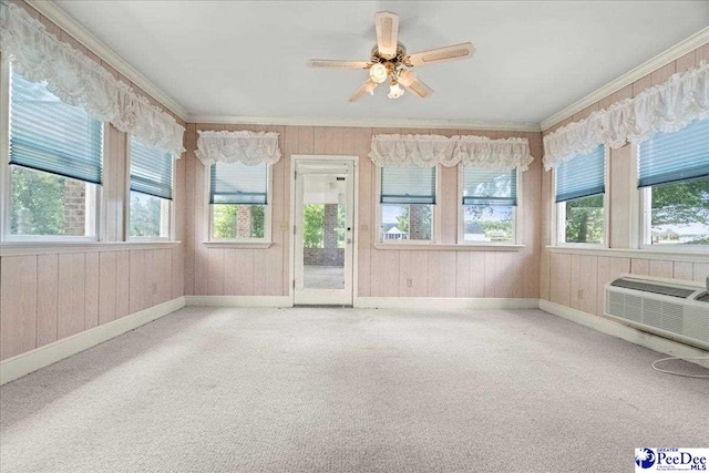 231 Timberlake Dr, Florence, SC 29501 - unfurnished sunroom with plenty of natural light, crown molding, carpet floors, wooden walls, and a wall mounted air conditioner