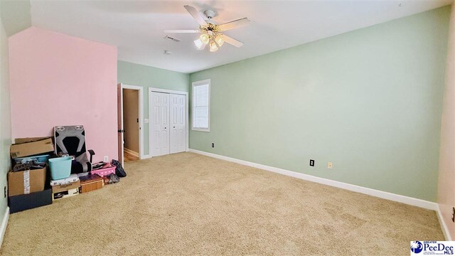 2423 Ben Hogan Cir, Florence, SC 29506 - unfurnished bedroom featuring carpet floors, baseboards, a closet, and ceiling fan