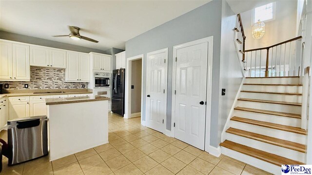 2423 Ben Hogan Cir, Florence, SC 29506 - kitchen with freestanding refrigerator, a ceiling fan, backsplash, and light tile patterned flooring