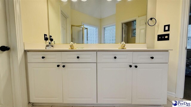 2423 Ben Hogan Cir, Florence, SC 29506 - bathroom featuring double vanity and baseboards