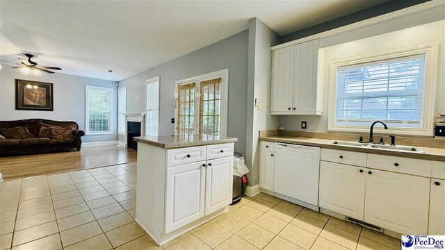 2423 Ben Hogan Cir, Florence, SC 29506 - kitchen with dishwasher, a sink, light tile patterned flooring, and ceiling fan