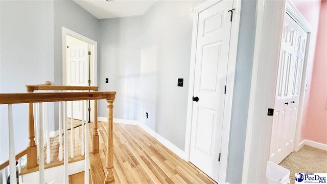 2423 Ben Hogan Cir, Florence, SC 29506 - hallway with baseboards and light wood-type flooring