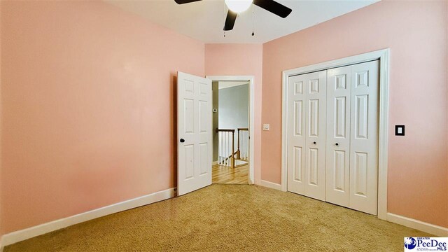 2423 Ben Hogan Cir, Florence, SC 29506 - unfurnished bedroom featuring light carpet, baseboards, a closet, and ceiling fan