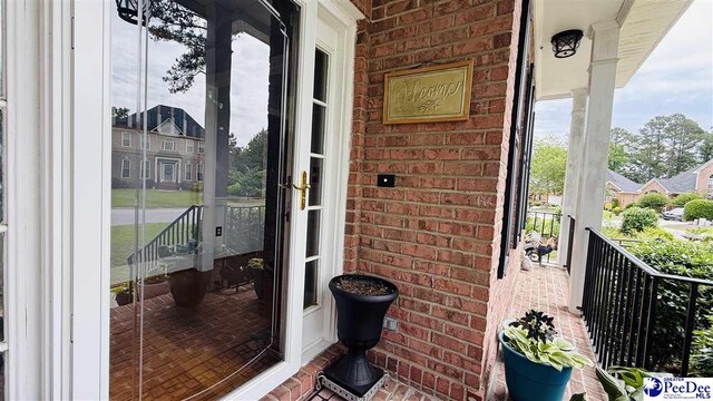 2423 Ben Hogan Cir, Florence, SC 29506 - property entrance featuring brick siding and covered porch