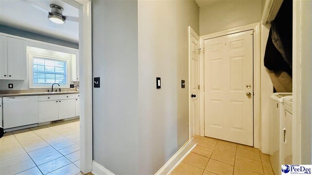 2423 Ben Hogan Cir, Florence, SC 29506 - corridor featuring light tile patterned floors, independent washer and dryer, and baseboards