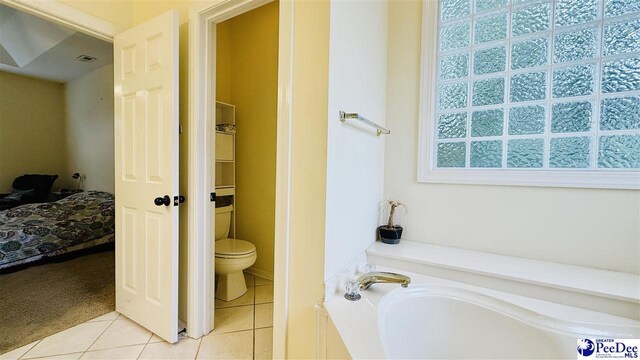 2423 Ben Hogan Cir, Florence, SC 29506 - full bath featuring a garden tub, tile patterned flooring, toilet, and ensuite bathroom