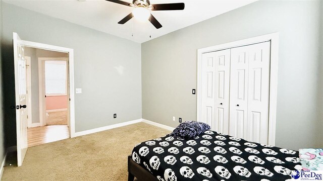 2423 Ben Hogan Cir, Florence, SC 29506 - carpeted bedroom featuring a closet, baseboards, and a ceiling fan