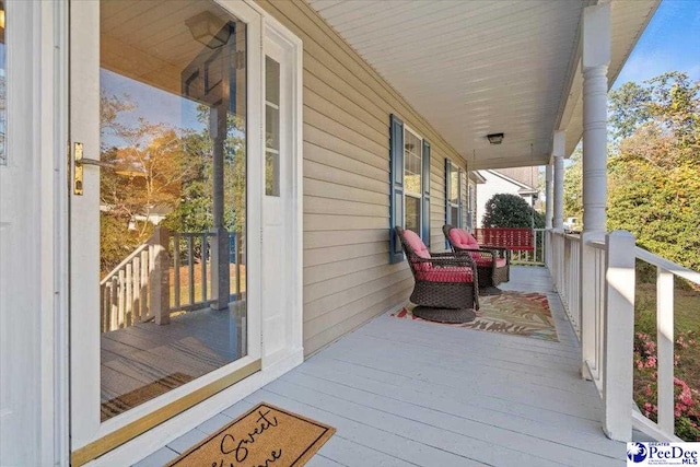 wooden deck featuring a porch