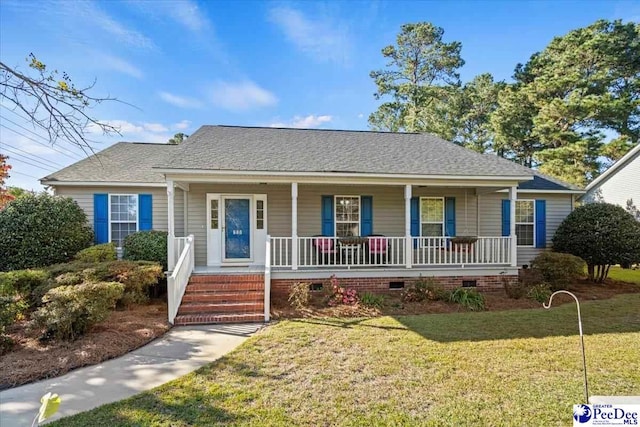 view of front facade with covered porch and a front yard