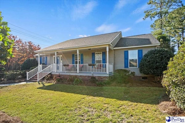 ranch-style home featuring a front yard and covered porch