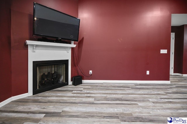 unfurnished living room featuring light hardwood / wood-style flooring