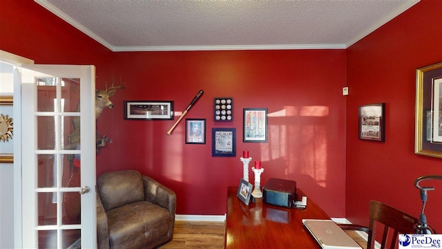 home office with hardwood / wood-style flooring, crown molding, and a textured ceiling