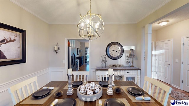 dining area with dark hardwood / wood-style flooring, a notable chandelier, and crown molding