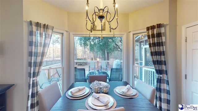 dining space with a chandelier