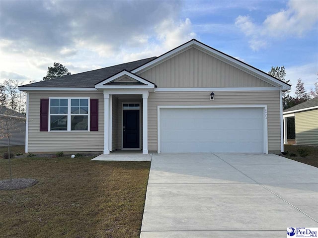 single story home featuring a garage and a front lawn