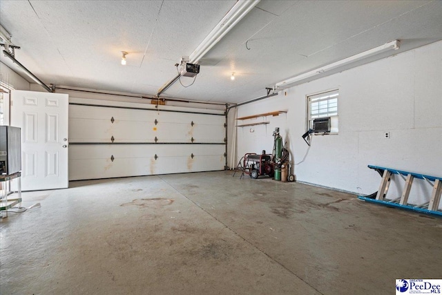 2810 Boxwood Ave, Florence, SC 29501 - garage with a garage door opener and cooling unit