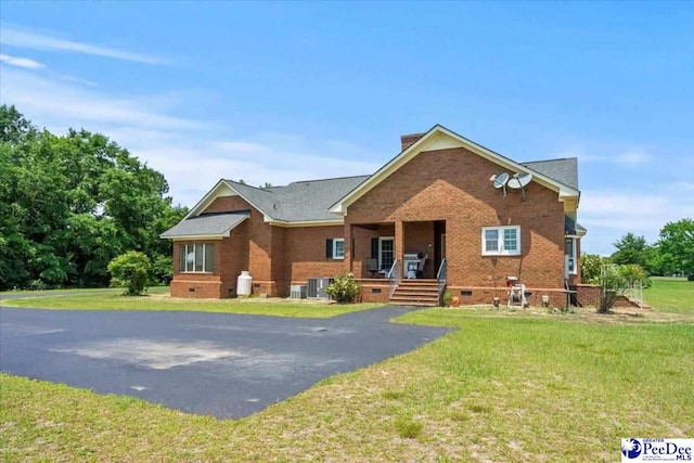 2284 Syracuse Community Rd, Darlington, SC 29532 - view of front of house with covered porch, brick siding, crawl space, and a front lawn