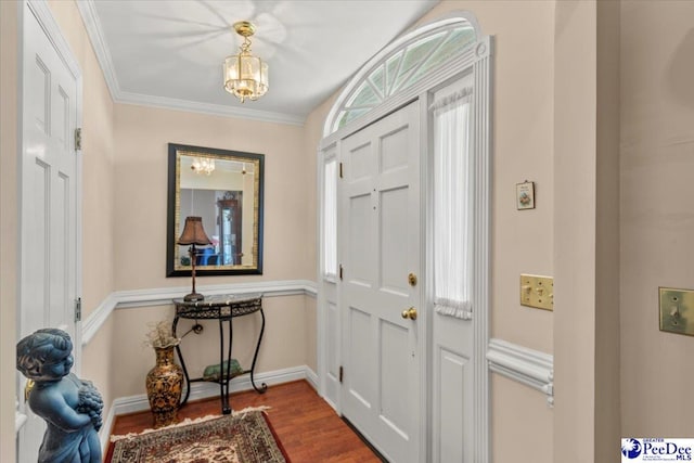 2284 Syracuse Community Rd, Darlington, SC 29532 - entrance foyer featuring wood finished floors, a chandelier, crown molding, and baseboards