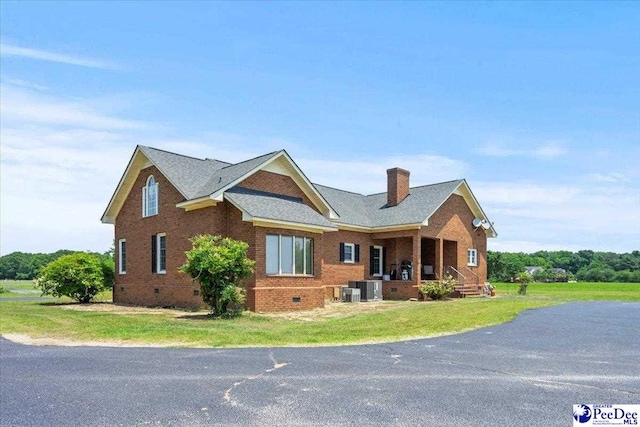 2284 Syracuse Community Rd, Darlington, SC 29532 - view of front of home featuring crawl space, brick siding, a porch, a chimney, and cooling unit