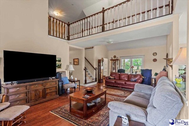2284 Syracuse Community Rd, Darlington, SC 29532 - living room with a high ceiling, stairway, and wood finished floors