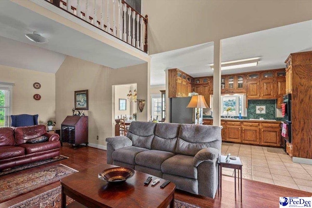 2284 Syracuse Community Rd, Darlington, SC 29532 - living area with baseboards, light tile patterned floors, and high vaulted ceiling