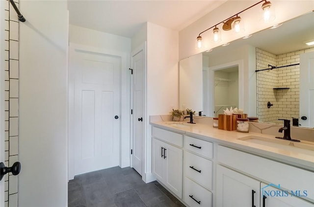 bathroom with double sink vanity and tile floors