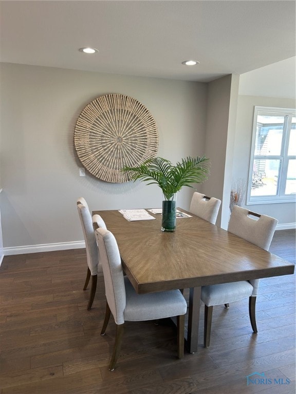 dining space featuring dark hardwood / wood-style floors