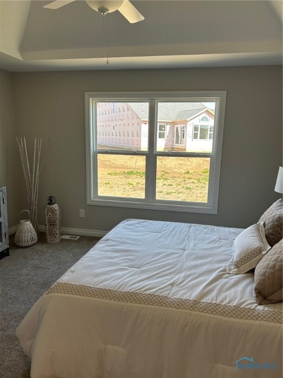 carpeted bedroom featuring ceiling fan