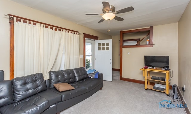 living room featuring ceiling fan and light colored carpet