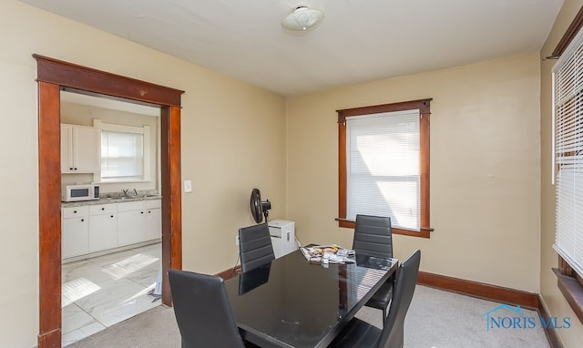 carpeted office featuring sink