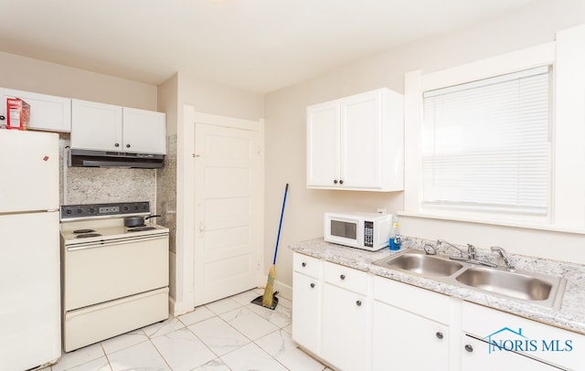 kitchen with light tile flooring, white appliances, white cabinetry, and sink