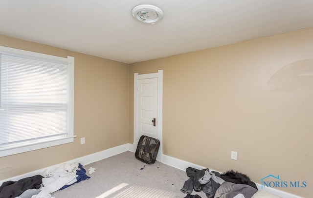 workout room with light colored carpet