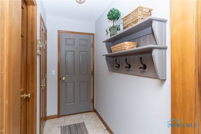 mudroom featuring light tile floors