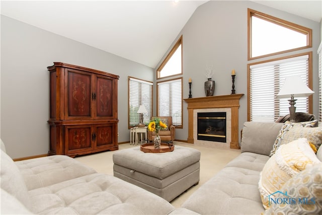 carpeted living room with high vaulted ceiling and a healthy amount of sunlight