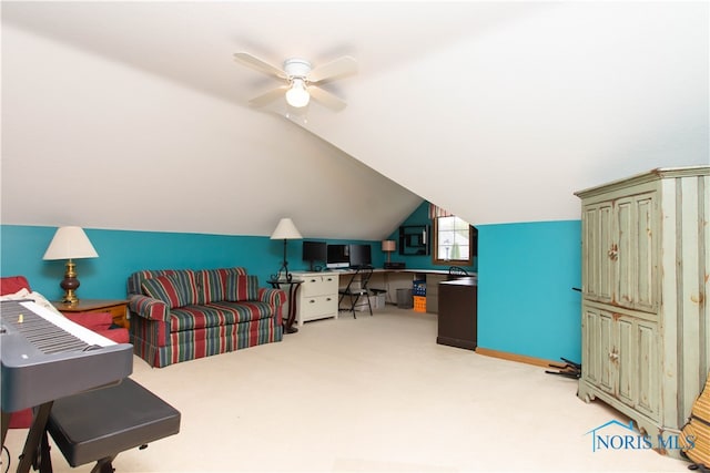 interior space with ceiling fan, lofted ceiling, and light carpet