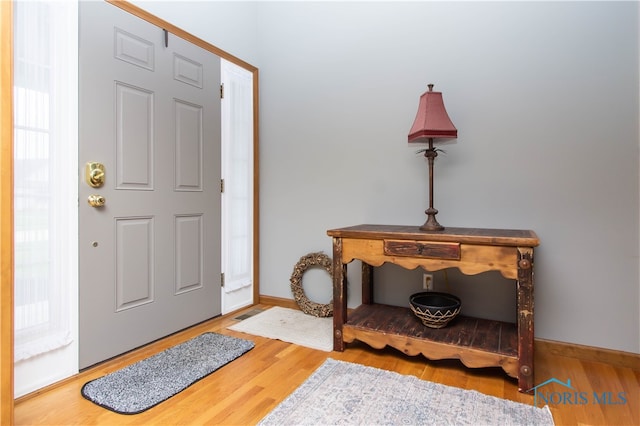 entryway with light hardwood / wood-style floors