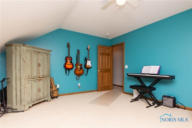 miscellaneous room featuring lofted ceiling, light colored carpet, and ceiling fan