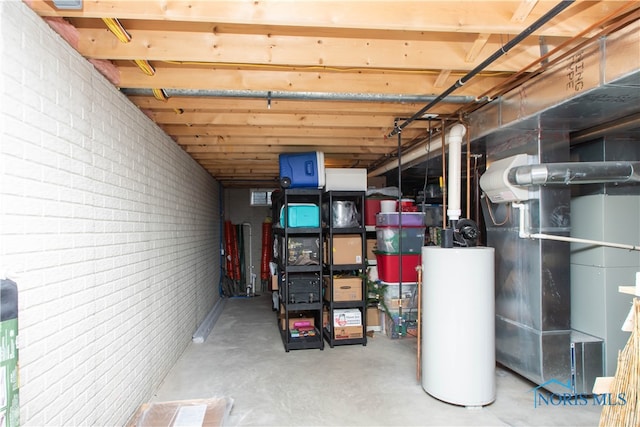 basement with brick wall and water heater