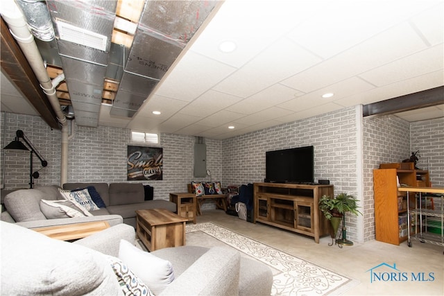 living room featuring brick wall