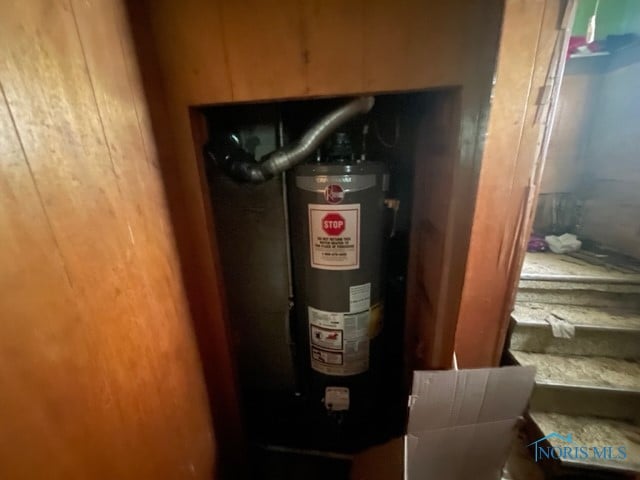 utility room featuring gas water heater