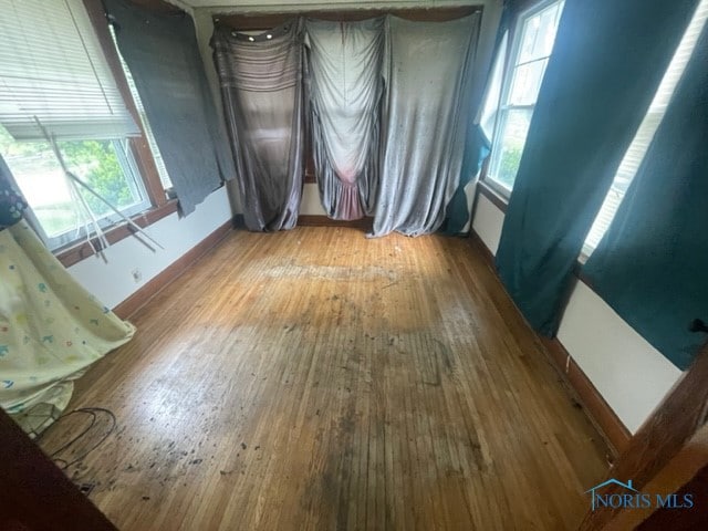 spare room featuring dark wood-type flooring