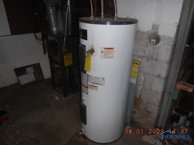 utility room featuring electric water heater